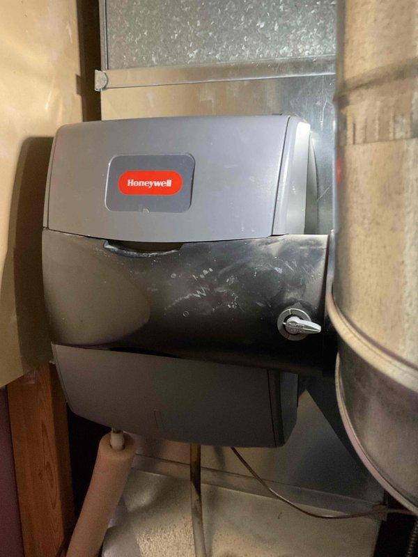 Responded to service call for customer Jean regarding a Honeywell humidifier with missing components. Located and installed new humidifier tray that was previously absent, as the original top carrier portion was missing. Completed installation of replacement tray to restore proper humidifier functionality.
