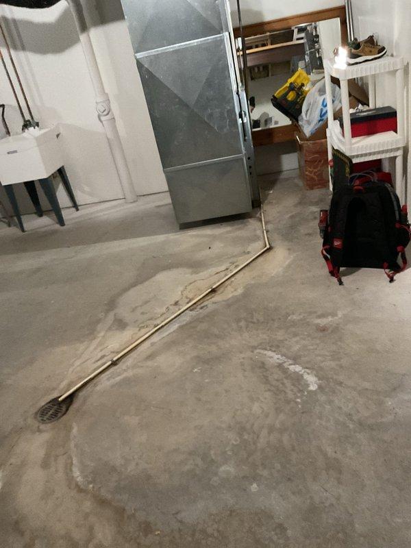 Responded to no-heat call where customer reported non-functional thermostat. Diagnostic inspection revealed multiple system failures including compromised combustion air intake, malfunctioning blower motor, and failed thermostat. Observed significant water damage in basement area near HVAC equipment. Provided customer with replacement options after determining extensive repairs would be needed.