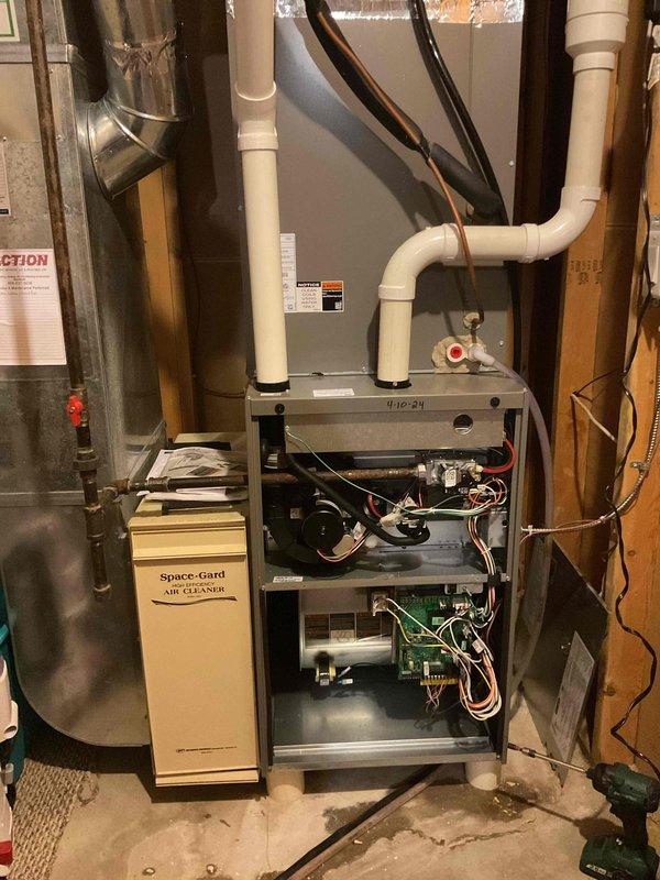 Responded to service call for Lennox furnace (2024 model) with water leakage and no heat. Diagnosed water leaking from humidifier system. Inspected internal components including circuit board, wiring harness, and gas valve. Serviced Space-Gard air cleaner unit. Restored proper operation of heating system by addressing humidifier leak and confirming proper functionality of gas valve.