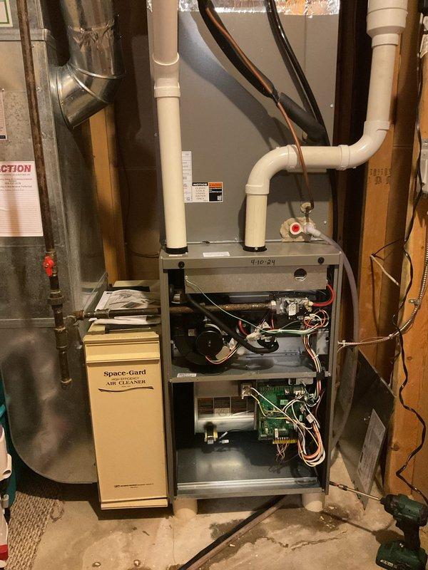 Responded to service call for Lennox furnace (2024 model) with water leakage and no heat. Diagnosed water leaking from humidifier system. Inspected internal components including circuit board, wiring harness, and gas valve. Serviced Space-Gard air cleaner unit. Restored proper operation of heating system by addressing humidifier leak and confirming proper functionality of gas valve.
