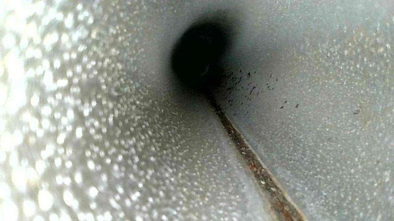 Responded to no heat complaint. Diagnostic inspection revealed severe frost accumulation on refrigerant lines indicating possible refrigerant flow restriction. Inspected ductwork and found rust on internal components suggesting potential moisture issues affecting system performance.