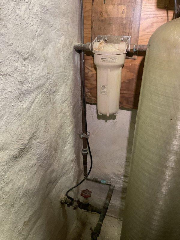 Responded to customer complaint of furnace noise and water filter system issues. Upon inspection, found Lennox furnace required cleaning of burner assembly and adjustment of gas valve to eliminate abnormal operating noise. Also serviced residential water treatment system, replacing filter cartridge and verifying proper operation of connected water softener tank. All systems now functioning correctly.