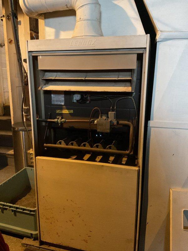 Responded to customer complaint of furnace noise and water filter system issues. Upon inspection, found Lennox furnace required cleaning of burner assembly and adjustment of gas valve to eliminate abnormal operating noise. Also serviced residential water treatment system, replacing filter cartridge and verifying proper operation of connected water softener tank. All systems now functioning correctly.