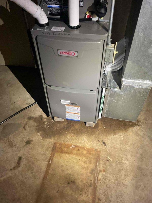 Responded to callback regarding reported water leakage from newly installed Lennox furnace. Upon inspection, confirmed no water was coming from the furnace itself; water staining on concrete floor appears to be pre-existing or from another source. Documented installation with photos showing proper connection of PVC ventilation/drainage pipes and adjacent water heater system.