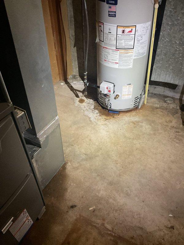 Responded to callback regarding reported water leakage from newly installed Lennox furnace. Upon inspection, confirmed no water was coming from the furnace itself; water staining on concrete floor appears to be pre-existing or from another source. Documented installation with photos showing proper connection of PVC ventilation/drainage pipes and adjacent water heater system.