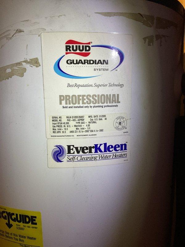 Responded to no-heat call at 4-unit apartment complex with 2005 RUUD Guardian System water heater exhibiting active leak. Visual inspection confirmed failure requiring complete replacement of aging unit. New EverKleen self-cleaning water heater was installed with all necessary plumbing connections to restore hot water service to all units.