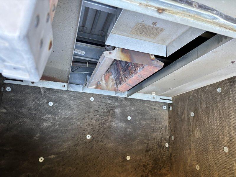 Responded to service call for furnace in rear shop not producing heat. Diagnosed issue with gas control module and performed system reset to restore proper operation. Observed significant rust and corrosion on heat exchanger panels during inspection.