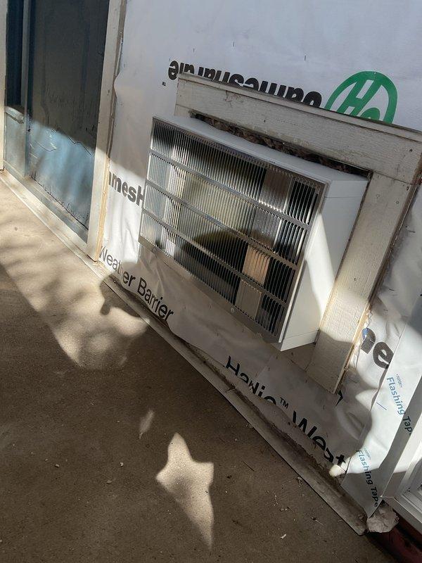 Completed installation of new baseboard heating units and wall-mounted air conditioning system in a fire-damaged unit. Properly mounted AC unit with white trim to the weather barrier wall surface and ensured proper connection. Verified system functionality before completing the job.