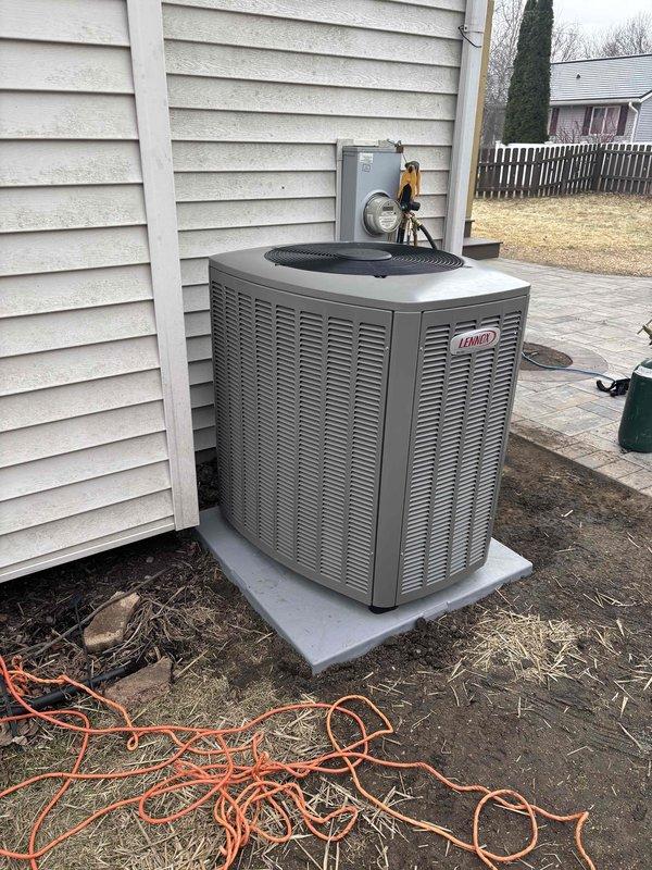 Successfully relocated customer's Lennox AC condenser unit around corner of house, extending refrigerant lineset and electrical connections to accommodate new position. Unit was properly installed on concrete pad with appropriate clearances, and system was tested for proper operation following the relocation.