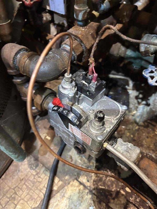 Diagnosed compatibility issue between customer's newly installed Google Nest thermostat and older boiler system, which was preventing heat from rising above 64°F. Inspected gas valve control mechanism and determined the aging system requires a conventional thermostat rather than smart technology. Recommended replacement of the thermostat with a compatible model or consideration of a complete boiler system upgrade.