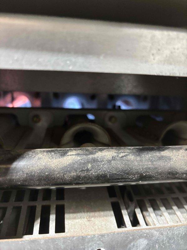 Responded to no heat complaint on 15+ year old furnace system. Diagnosed faulty ignitor preventing proper burner ignition. Replaced ignitor and verified proper burner operation with strong blue flame pattern, restoring heat to the residence.