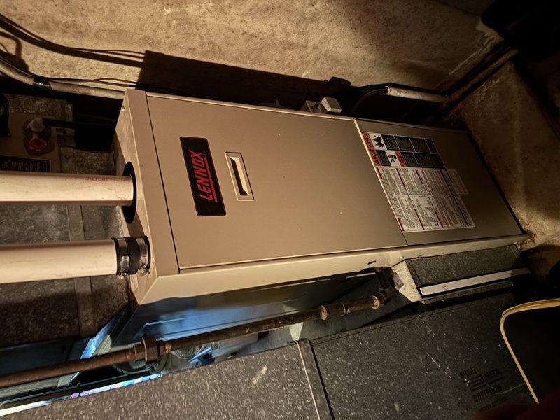 Responded to no-heat call for Lennox furnace system. Diagnosed failed inducer motor causing heat failure. Presented customer with replacement options and provided quote for new furnace installation as the unit appears to be aging with visible wear in the utility area.
