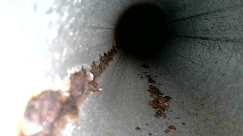 Responded to no-heat complaint on Goodman furnace. Inspection revealed significant rust and corrosion inside heat exchanger flue pipe, indicating potential heat exchanger failure. Recommended complete furnace replacement due to safety concerns; provided customer with replacement quote.
