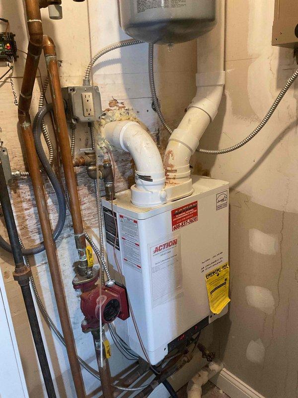Responded to no heat call for an Action boiler system. Diagnosed issue as a clogged condensate trap causing system failure. Service included cleaning the condensate trap and igniter, restoring proper boiler operation and heat to the residence.