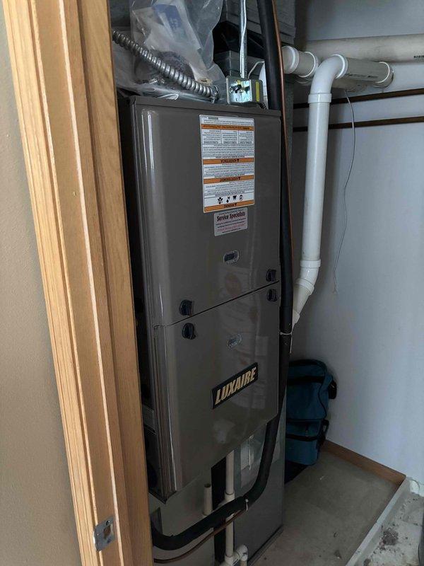 Responded to no heat service call for Luxaire furnace unit. Diagnosed failed inducer motor preventing system startup. Replaced inducer motor assembly and verified proper system operation, restoring heat to residence. Also provided thermostat operation instructions to resolve sleep mode issue.