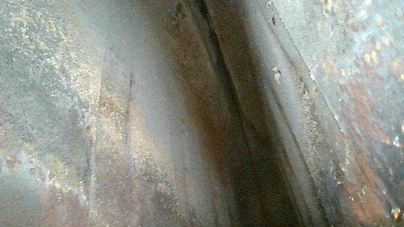 Responded to no-heat emergency call for 10+ year old gas furnace. Upon inspection, identified significant corrosion on heat exchanger and deteriorated gas valve/thermocouple assembly. Replaced faulty components and verified proper ignition sequence, restoring heat functionality. Recommended system evaluation for potential replacement due to age and visible metal deterioration.