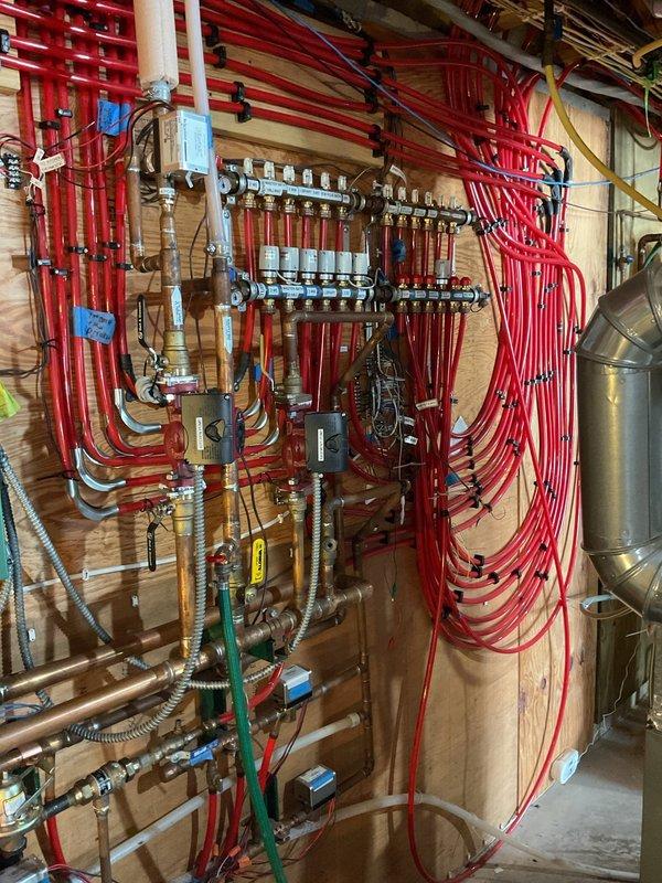 Responded to service call for gas odor at inline boiler system. Performed diagnostic inspection, identifying issues with igniter requiring cleaning. Completed maintenance including igniter cleaning, trap cleaning, and proper pressurization of captive air tank. System tested for proper operation after service with all functions restored.