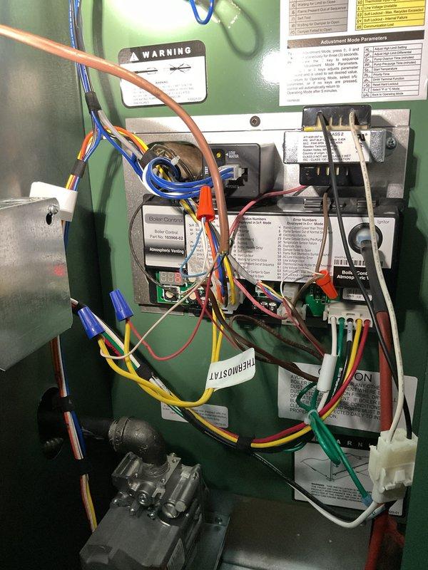 # Service Report

Responded to service call for boiler not operating following installation completed previous week. Upon arrival, accessed control panel and performed comprehensive diagnostic of electrical system and safety controls. Identified wiring connection issues affecting proper system operation. Verified and corrected all wire terminations at control board, transformer, relay, and gas valve connections. Ensured proper wire routing and secure connections throughout control panel using appropriate wire nuts. Tested all safety interlocks and limit controls for proper operation. Verified gas valve functionality and control signal integrity. Cycled system through multiple heating cycles to confirm reliable ignition sequence and burner operation. All components now functioning within manufacturer specifications. System operational and customer informed of proper operation procedures.