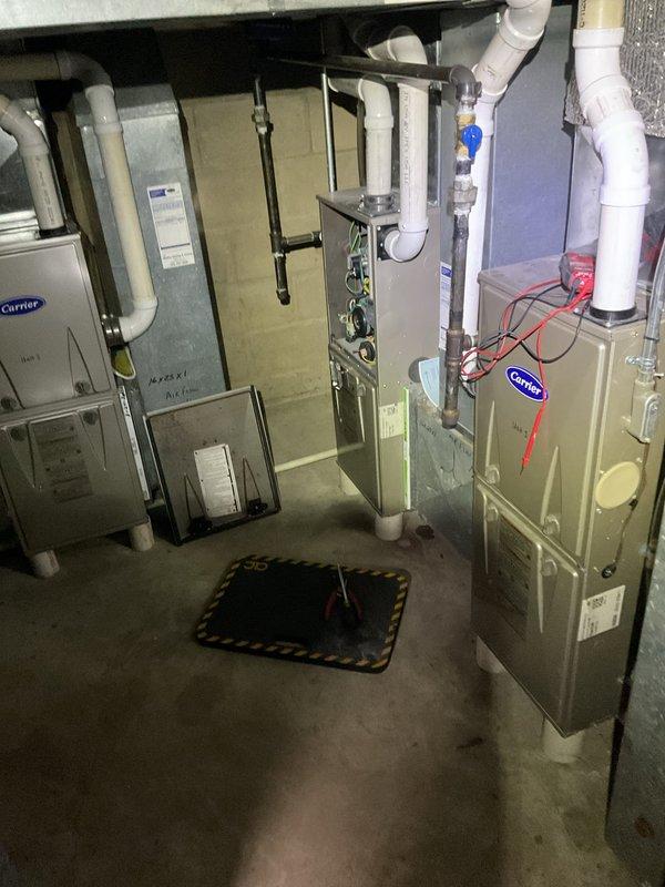 Responded to no-heat call on Carrier furnace system. Replaced thermostat batteries, cleaned condensate trap to remove blockage, and cleaned flame sensor. Verified proper ignition sequence and confirmed unit achieved stable combustion and normal heating operation upon completion.