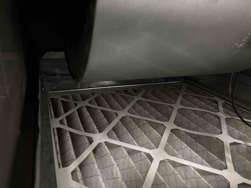 Completed maintenance and repairs on five furnace units. Replaced ignitors and flame sensors on all units to restore proper ignition and combustion safety controls. Installed filter blockers in filter racks to improve air filtration system performance and prevent bypass. Inspected secondary coils for cleanliness and potential cleaning requirements.