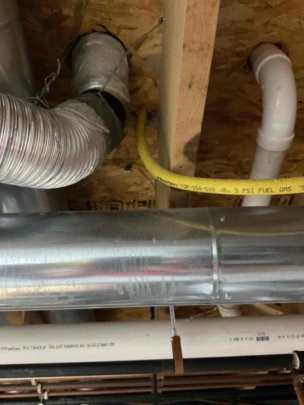 # HVAC Service Completed

Responded to service call to cap off an unused gas line previously connected to a dryer appliance. Upon arrival, located the gas supply line in the utility area where the dryer had been removed or relocated. The flexible gas connector and rigid gas piping were identified running through the floor joists in the mechanical space.

Performed safe gas line capping procedure by shutting off the gas supply at the nearest upstream valve. Disconnected the flexible gas connector from the supply line. Installed an approved gas line cap on the exposed 1/2" gas pipe stub to permanently seal the line. Verified proper threading and applied pipe thread sealant rated for natural gas or propane applications to ensure a leak-free connection.

Conducted pressure test and leak detection using electronic gas detector and soap bubble solution to confirm the integrity of the cap installation. No gas leaks detected at the capped connection point or surrounding gas line fittings. The 