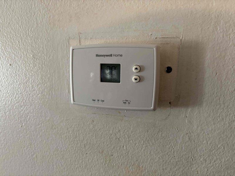 Responded to no heat call and identified improperly wired thermostat causing system malfunction and overheating of conditioned space. Diagnosed incorrect wiring configuration on Honeywell Home thermostat connected to ComfortMaker furnace unit. Corrected thermostat wiring per manufacturer specifications and replaced blown fuse. Verified proper system operation, confirmed heating cycle functionality, and ensured thermostat communication with furnace. System restored to normal operation with accurate temperature control.