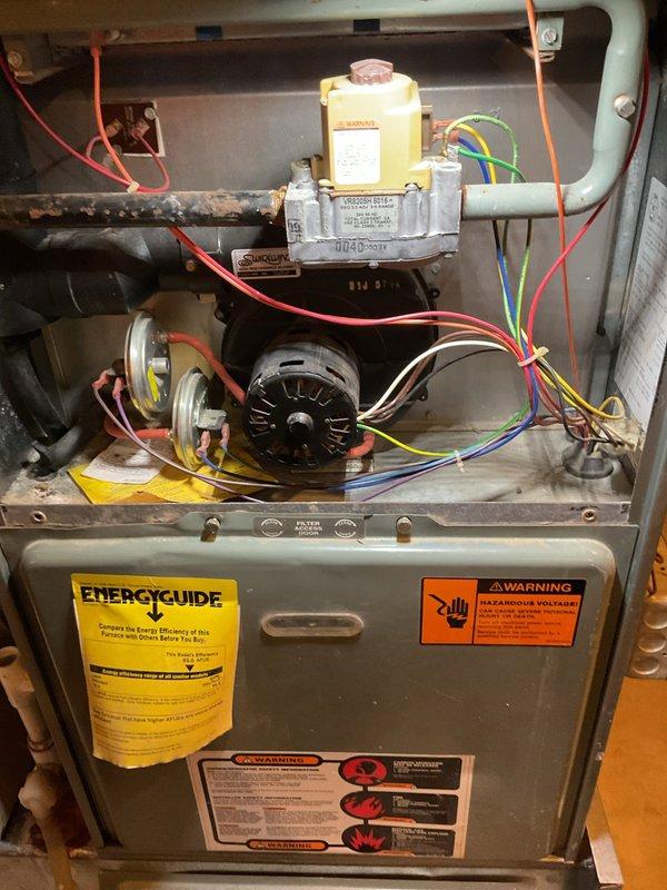 Responded to no heat call where thermostat was reported as not working. Upon inspection, diagnosed failed capacitor on the draft inducer motor. Removed defective inducer assembly and installed new replacement inducer motor. Verified proper operation of furnace, confirmed ignition sequence, and tested heating cycle. Unit restored to normal operation with adequate heat output.