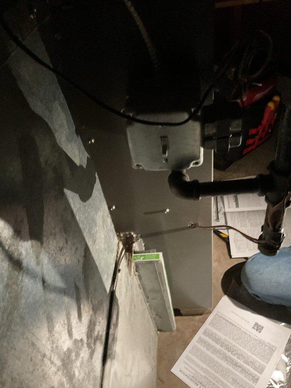 Responded to warranty call for recently installed furnace experiencing severe vibration and shaking. Upon inspection, discovered air filter had collapsed with metal mesh completely missing, having been drawn into the system due to excessive negative pressure. Determined cold air return duct was undersized for the furnace specifications, creating insufficient airflow and causing the filter failure. Removed damaged filter debris from system, took measurements of existing cold air return for proper resizing and fabrication to prevent recurrence of the issue.