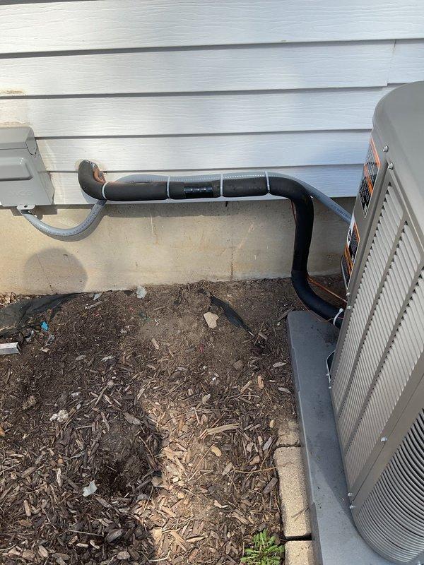 Responded to warranty call back for failed inspection on outdoor HVAC installation. Replaced oversized circuit breaker with properly rated breaker to meet electrical code requirements. Secured refrigerant line set that was previously improperly attached with liquid tight conduit. Properly tied up and secured line set along foundation using appropriate mounting brackets. All electrical connections verified and system tested for proper operation. Installation now complies with code requirements and passed re-inspection.