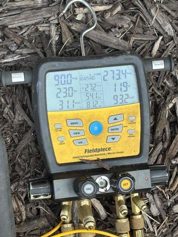 Performed seasonal startup and system check on outdoor air conditioning unit. Connected manifold gauges to measure refrigerant pressures and verified system operating parameters using digital HVAC diagnostic equipment. Inspected soldered refrigerant line joint per customer concern regarding appearance; joint appears cosmetically discolored but remains structurally sound with no active leaks detected. All system pressures and temperatures reading within normal operating range for R454B refrigerant. Unit cycling properly and providing adequate cooling.