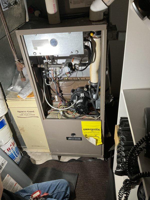 Responded to no heat call on Goodman direct vent forced air furnace, model GY9S00B12UP11J. Upon inspection, diagnosed insufficient vacuum at pressure switch preventing unit operation. Testing revealed inducer motor failure causing inadequate draft pressure to satisfy safety controls. Provided customer with repair options including inducer motor replacement or complete furnace replacement given unit age and condition.