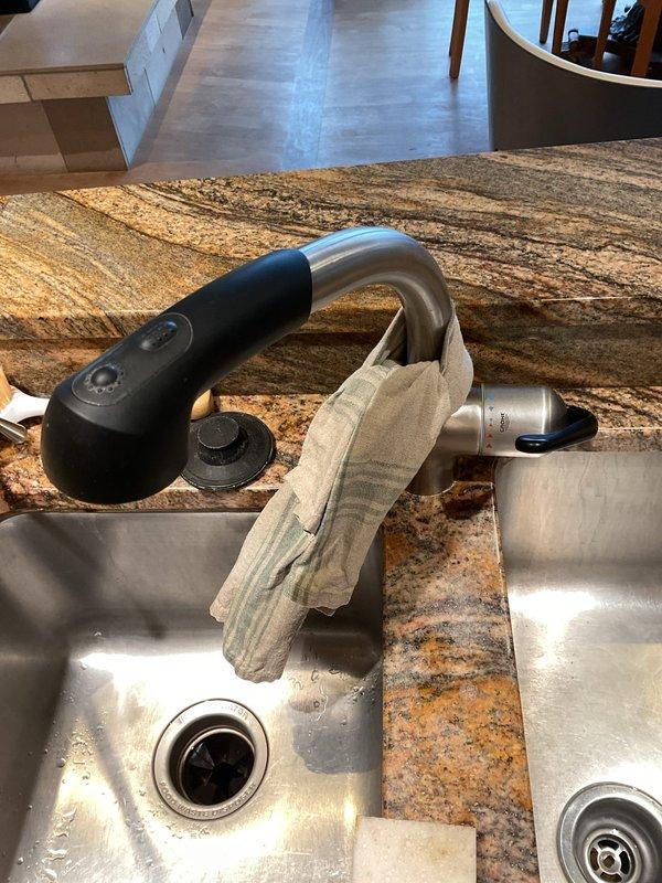 Performed preventative maintenance clean and check on three A/C units per seasonal service protocol. All three units inspected, cleaned, and verified operational. Additionally inspected kitchen faucet as requested; faucet is a modern pull-down spray model with control buttons on handle, currently functional with no leaks observed in supply lines or drain assembly beneath sink, which includes garbage disposal unit with properly connected water supply lines, drain hoses, and shut-off valves.