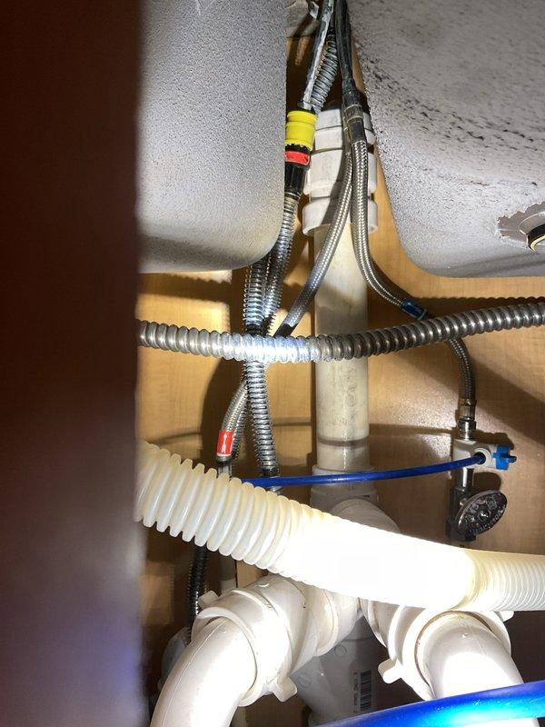 Performed preventative maintenance clean and check on three A/C units per seasonal service protocol. All three units inspected, cleaned, and verified operational. Additionally inspected kitchen faucet as requested; faucet is a modern pull-down spray model with control buttons on handle, currently functional with no leaks observed in supply lines or drain assembly beneath sink, which includes garbage disposal unit with properly connected water supply lines, drain hoses, and shut-off valves.