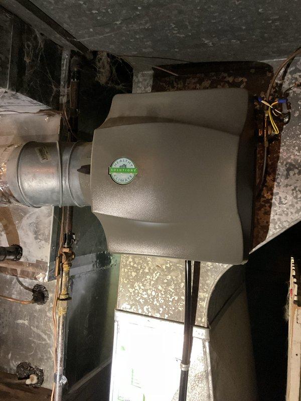 Responded to service call for water accumulation under furnace. Upon inspection, identified moisture issue in basement mechanical room near Lennox furnace and air handler system. Replaced air filter with homeowner-supplied #35 X2661 filter per manufacturer specifications. Documented HVAC system installation including blower unit, ductwork, and associated components in attic crawl space and basement locations. Verified system operation and confirmed no active leaks present at time of service completion.