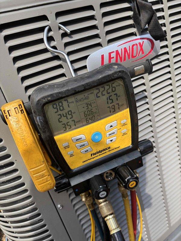Completed installation of new Lennox condensing unit on existing concrete pad. Set condenser on site, connected refrigerant lines, and performed system startup procedures. Utilized digital manifold gauges to verify system pressures and temperatures across suction and liquid lines, confirming proper refrigerant charge and operational parameters. All readings stabilized within manufacturer specifications for optimal system performance.