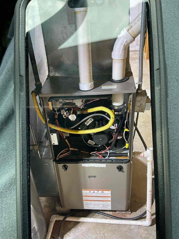 Responded to gas leak call on residential furnace system. Upon inspection, identified gas leaking through the gas valve into the burners. Replaced defective gas valve and gas supply whip. Performed combustion analysis with CO reading of 7 ppm, which is within acceptable limits. Verified proper ignition and burner operation. Conducted thorough leak check of furnace cabinet and blower compartment with no additional leaks detected. Unit returned to safe operating condition.