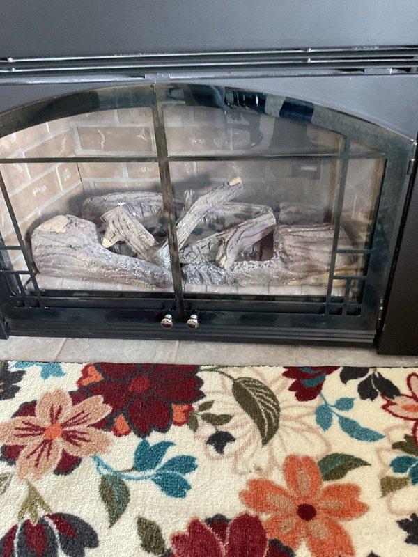 Responded to gas leak detection report from utility company. Located and repaired two gas leaks: one at corrugated piping connection serving gas fireplace, and one at furnace nut fitting requiring replacement. After completing repairs, re-lit gas fireplace, repositioned embers, and performed comprehensive leak check of all connections. Confirmed no gas leaks detected upon final inspection.