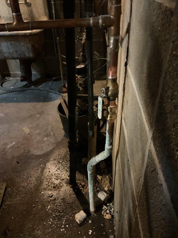 Responded to gas leak call at residential property. Upon arrival, conducted thorough inspection of basement utility area containing furnace and dual water heater installation. Used combustible gas detector to systematically check all gas piping connections, valves, and fittings throughout the mechanical room. Identified leak at brass ball valve connection on copper gas supply line. Shut off main gas supply and verified system was safe. Tightened compromised fitting and applied pipe thread sealant to connection. Pressure tested gas line system and confirmed no further leaks detected. Restored gas service and verified proper operation of all appliances. System returned to safe working condition.