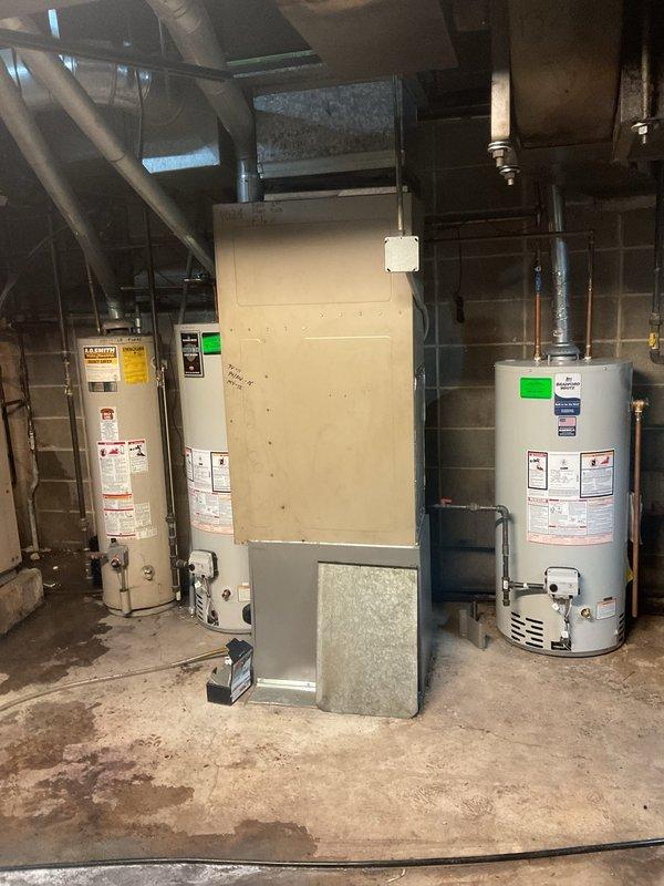 Responded to gas leak call at residential property. Upon arrival, conducted thorough inspection of basement utility area containing furnace and dual water heater installation. Used combustible gas detector to systematically check all gas piping connections, valves, and fittings throughout the mechanical room. Identified leak at brass ball valve connection on copper gas supply line. Shut off main gas supply and verified system was safe. Tightened compromised fitting and applied pipe thread sealant to connection. Pressure tested gas line system and confirmed no further leaks detected. Restored gas service and verified proper operation of all appliances. System returned to safe working condition.