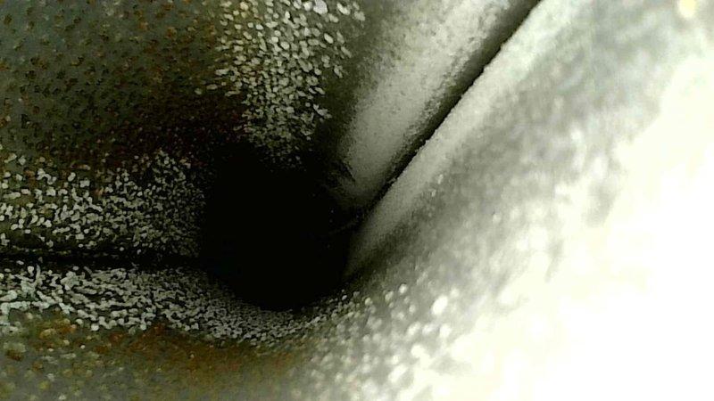 Responded to service call for furnace producing unusual noise during operation, specifically when blower fan was running. Performed diagnostic inspection and identified failing lower blower motor as source of noise. Unit was still operational but motor exhibited signs of imminent failure. Documented existing condensation on ductwork and inspected internal components including insulation panels. Provided customer with replacement furnace quote as recommended long-term solution given age and condition of existing equipment.