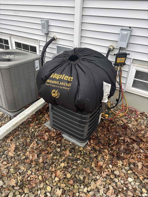 Performed seasonal clean and check maintenance on Goodman air conditioning system per customer's online coupon request. Following COVID safety protocols for immune-compromised occupant, completed exterior preventive maintenance service including inspection of condenser unit, cleaning of coils, and system performance verification. All components found operating within normal parameters with no deficiencies noted.