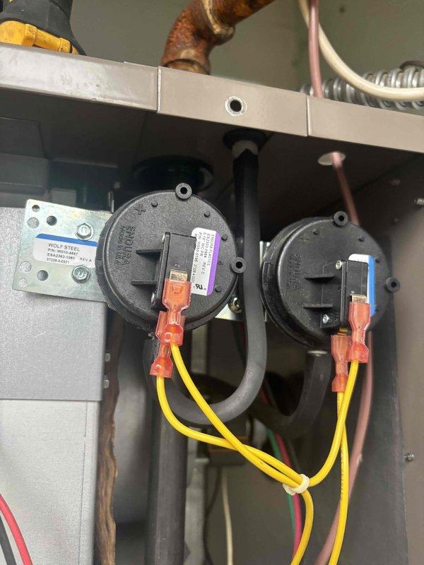 Responded to no heat call on Wolf Steel furnace unit. Upon inspection, found dual pressure switches with proper electrical connections and mounting intact. Verified control relay and associated wiring connections. Noted significant corrosion on copper refrigerant lines requiring future attention but not affecting current heating operation. System components including pressure switches and controls functioning properly after diagnostic evaluation. Unit restored to normal heating operation and customer advised to monitor performance with follow-up scheduled to confirm continued proper operation.