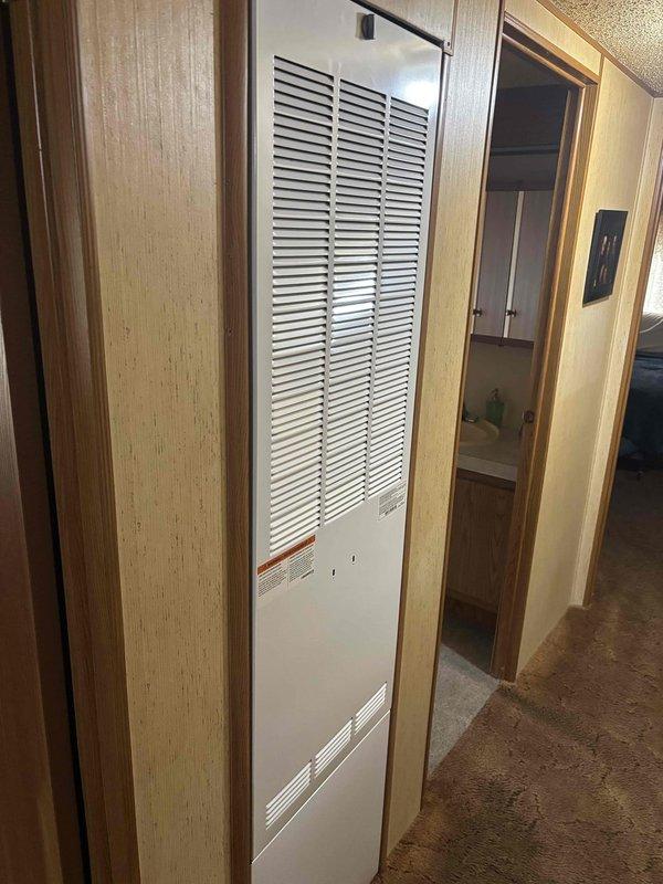 Responded to no-heat call on RV furnace unit. Previous service provider had diagnosed failed igniter with zero ohm reading. Confirmed diagnosis and replaced defective igniter. Verified proper combustion with blue flame established in burner chamber. Tested unit operation and confirmed heating system restored to full functionality.