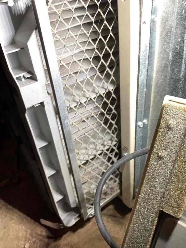 Performed state-required furnace inspection and identified critical safety hazard with carbon monoxide levels measuring 116 PPM in flue gases, exceeding safe operational limits. Due to dangerous CO levels posing immediate health risk, unit was red-tagged and taken out of service per safety regulations. Additionally noted heavily soiled air filter requiring replacement, with significant dust and debris accumulation throughout mesh structure affecting system airflow and efficiency.