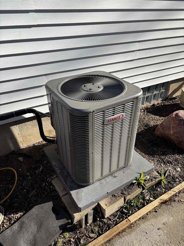 Completed installation of new Lennox air conditioner and furnace system with reconnection to existing ductwork. Installed new refrigerant line set, concrete equipment pad, electrical whip and disconnect, and Wi-Fi thermostat. Ran new low voltage wiring to support thermostat communication. Upon startup, identified system was overcharged and adjusted refrigerant levels to manufacturer specifications, achieving proper operating temperatures of 41.3°F and 43.9°F at the evaporator coil. Both heating and cooling units tested and confirmed operational. Noted during inspection that overcurrent protection device is oversized for the equipment and vent/intake PVC piping requires additional support for code compliance.