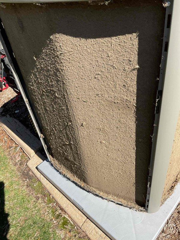 Responded to no cooling complaint on residential air conditioning unit. Found severely clogged air filter restricting airflow and improper thermostat wiring preventing compressor operation. Cleaned condenser coil, replaced air filter, and installed jumper wire between Y1 and Y2 terminals to restore proper cooling cycle. Unit tested and operating normally upon departure.