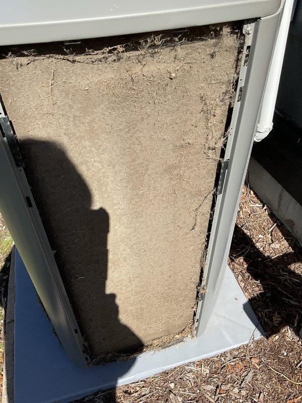Responded to no cooling complaint on residential air conditioning unit. Found severely clogged air filter restricting airflow and improper thermostat wiring preventing compressor operation. Cleaned condenser coil, replaced air filter, and installed jumper wire between Y1 and Y2 terminals to restore proper cooling cycle. Unit tested and operating normally upon departure.