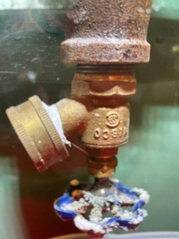 Responded to leak on newly installed boiler system. Upon inspection, identified minor water seepage at the boiler drain valve gland nut. Tightened the loose gland nut to proper specification, resolving the leak. System tested and confirmed operational with no further water discharge detected.