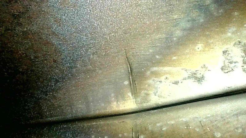 Responded to no heat call on residential gas furnace that was previously shut down due to cracked heat exchanger. Upon inspection, confirmed extensive deterioration and corrosion on heat exchanger with visible surface degradation, rust patterns, and compromised metal integrity presenting serious safety hazard. Unit deemed unsafe for operation due to crack allowing potential carbon monoxide exposure. Documented conditions with photos and provided system replacement quote to customer.