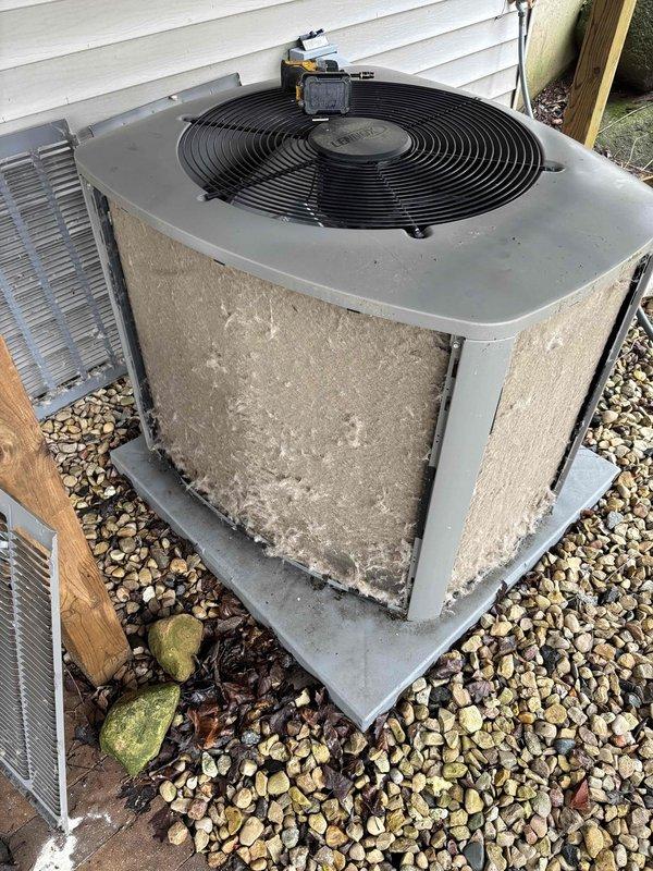 Completed comprehensive AC tune-up and cleaning service on outdoor condensing unit. Performed system diagnostics using digital manifold gauges, measuring refrigerant pressures and temperatures to verify proper operation—readings indicated system operating within normal parameters. Cleaned exterior condenser coils and housing, removing accumulated dirt, debris, and mineral deposits from weathered cabinet panels. Unit tested and confirmed operational with acceptable performance metrics.